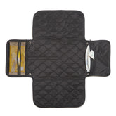 shorty-love quilted changing pad folded for compact travel.
