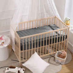 Two-color satin sheets fit widely used pack n play setups for versatile use.