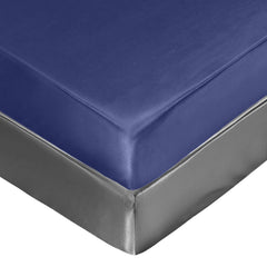 Satin mini crib sheets show a silk-like texture highlighting a smooth sleeping surface.