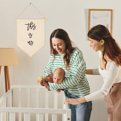 Sioial banner hanging on wall showcases cotton canvas texture for warm home accents.