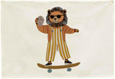 Sioial Lion Skateboarding Nursery Banner on beige canvas adds cozy charm to kids' spaces.