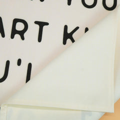 Sioial banner flag beige hanging setup in a classroom.