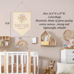 Sioial beige nursery banner complements wall color.