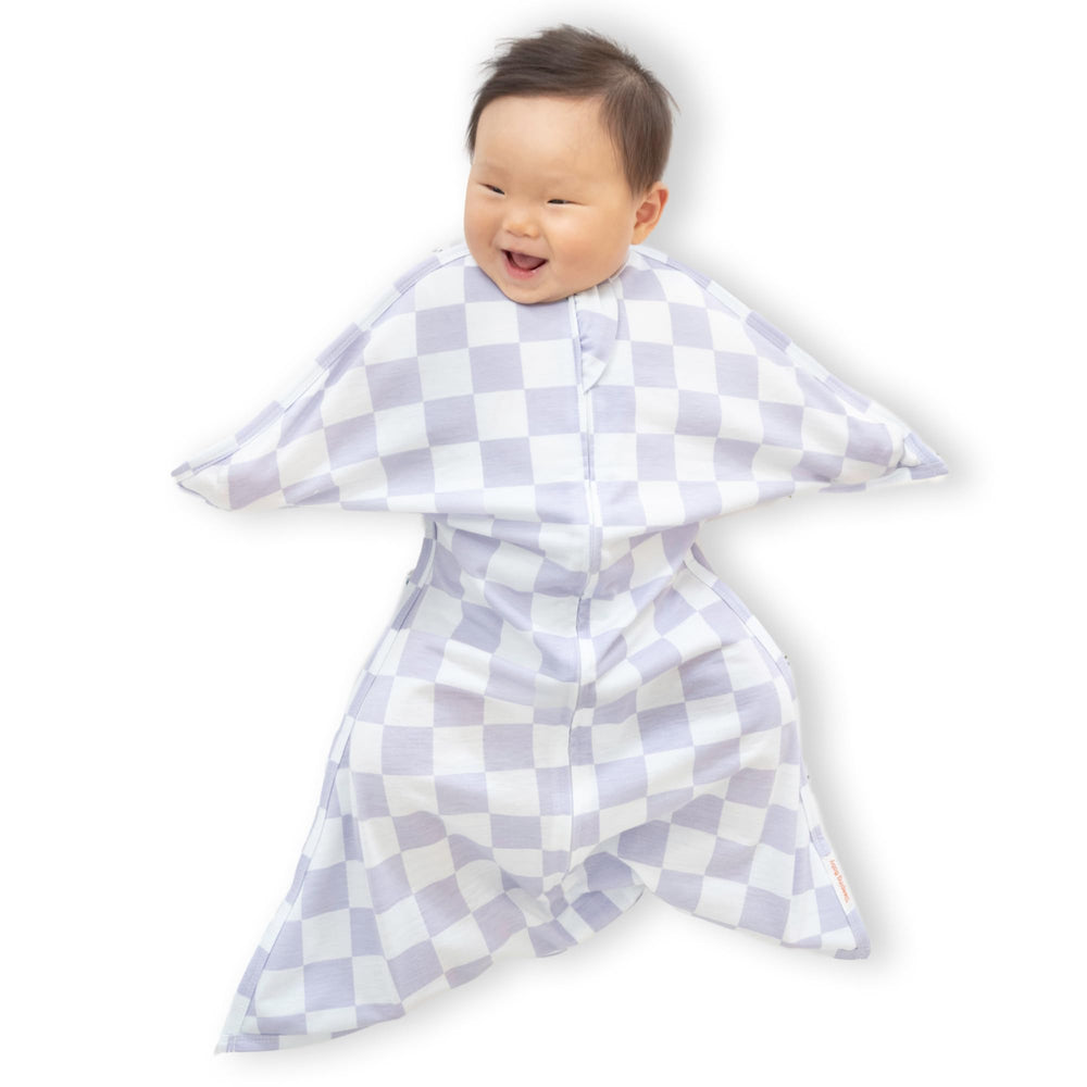 SleepingBaby Zipadee-Zip Lavender Check swaddle with secure fit for calm, rest-friendly sleep.