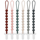 Slotic pacifier clip pack of six keeps pacifiers within reach on the go.