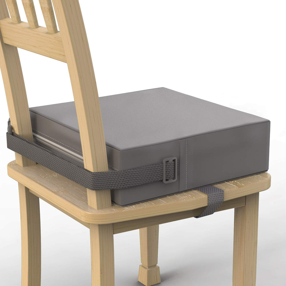 SMZCTYI Toddler Booster Seat on a grey chair offers stable, comfortable dining support