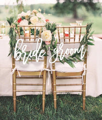 Snlioek chair sign used at rehearsal dinner as a personal touch.