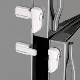 Snowharp child proof freezer latch with front and rear buttons for one-handed use.