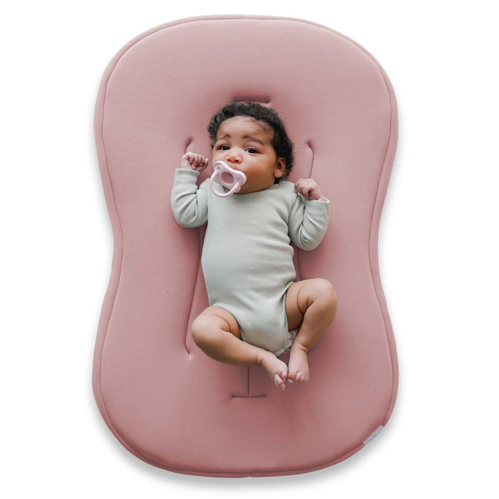 Snuggle Me Lounger Curve cover close-up showing buttery-soft organic cotton for gentle infant contact.