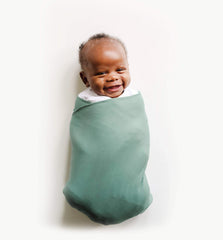 Snuggle Me Swaddle organic cotton close-up highlighting silky stretch for comfy swaddling.