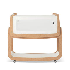 SnuzPod 5 bedside bassinet with breathable windows for visibility and airflow.