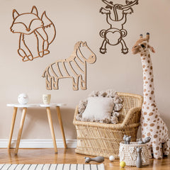 Soaoo Giraffe wall art adds friendly height and warmth to a nursery.