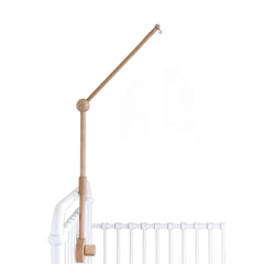 Sorrel + Fern baby crib mobile arm in natural beechwood securely holds a mobile.