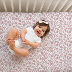 Sorrel + Fern crib sheets Antique Rose folded edges demonstrating durable elastic and snug hug