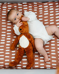 Mini crib sheet with deep elastic pockets for snug fit