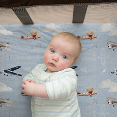 Sorrel + Fern sheets showing deep elastic pockets for secure, quick-fit on Graco playards.