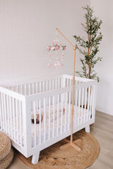 Sorrel + Fern unicorn-blossom-mobile features rose details and pom-poms for cozy ambiance.