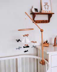 Sorrel and Fern wooden baby mobile showcasing planes in the clouds for nursery charm
