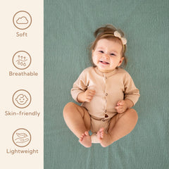 SOULFUL elastic band closeup on mini crib sheets shows secure, flat fit