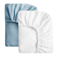 SOULFUL muslin crib sheets in white and blue laid flat for a soft, breathable sleep surface.