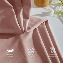 StangH dusty-pink velvet drapes with rich texture in a bedroom.