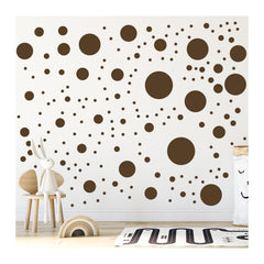 StickerDeen brown polka dot circle wall sticker on a nursery wall for playful decor.