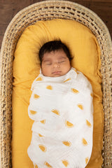 Sticky Toffee Muslin Swaddle Blanket, soft weave close view for newborn comfort.