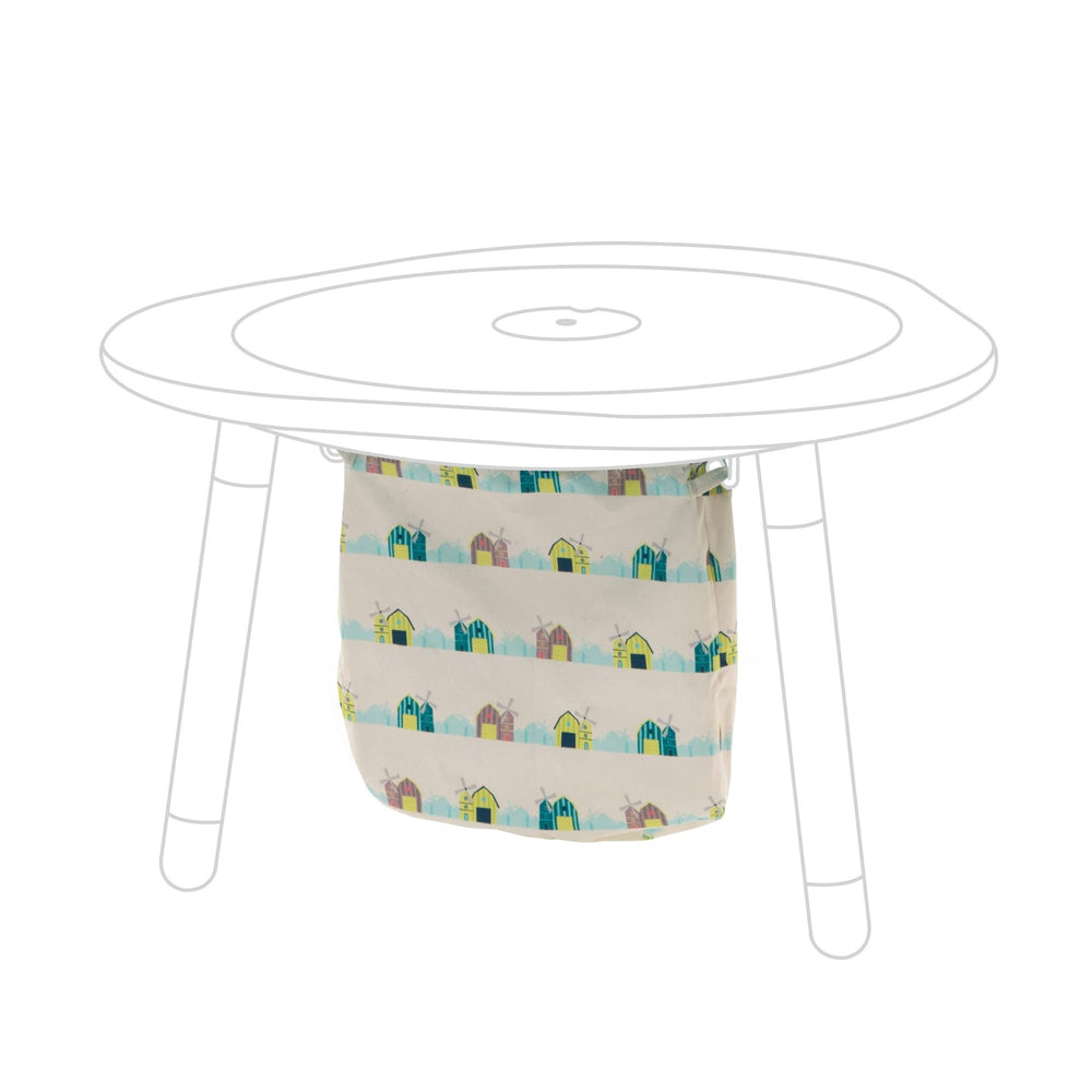 Stokke MuTable cotton bag with windmills keeps toys organized and play area tidy.