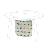 Stokke MuTable cotton bag with windmills keeps toys organized and play area tidy.