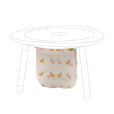 Stokke MuTable Cotton Bag with Chicks pattern attached to hooks for tidy toy storage.