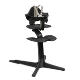 Stokke Nomi high chair at table for family dining and interaction