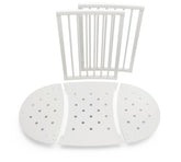 Stokke Sleepi Bed Extension V2 assembly demonstrates easy crib-to-bed transformation.