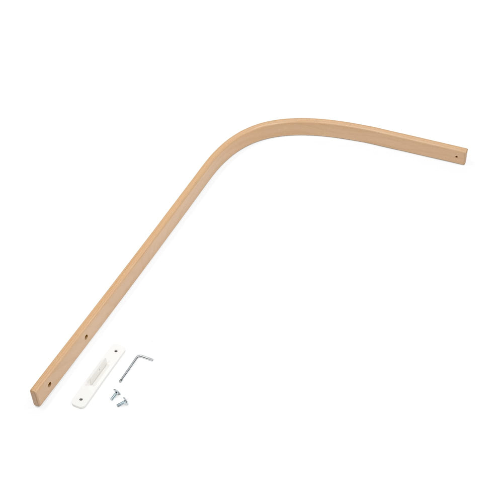 Stokke Sleepi Drape Rod V3 natural hangs a curtain to create a calm nursery ambience.