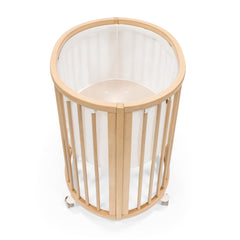 Stokke Sleepi Mini Mesh Liner V3 white closeup showing breathable fabric for safe sleep.