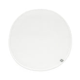 Stokke Sleepi Mini Protection Sheet V3 in white on bed, keeping the sleep surface clean.