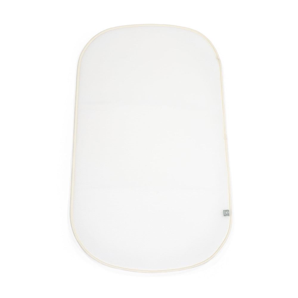 Stokke Snoozi Protection Sheet mattress cover keeps the bassinet clean and fresh