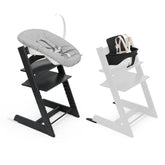 Stokke Tripp Trapp chair black with newborn set, ergonomic seating.