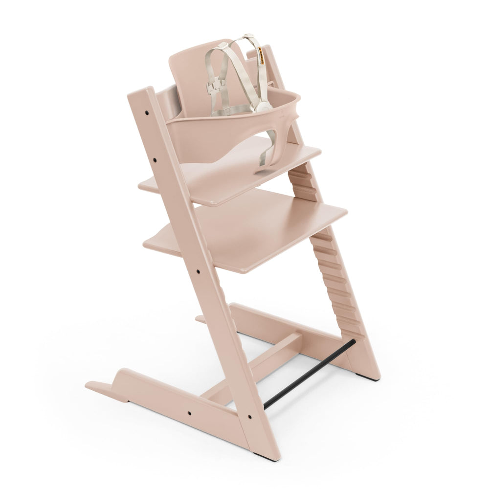 Stokke Tripp Trapp Serene Pink chair brings baby to the table for family meals.