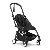 Stokke YOYO3 black frame, side view showing sleek, portable design.