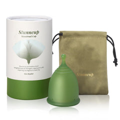 Stunncup soft menstrual cup green close-up, BPA-free comfort for all-day wear.