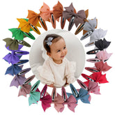 Sugarmelon boutique-style bow closeup on a tiny clip, crafted for delicate baby hair.