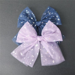 Sugarmelon large tulle bow hair clip side view showing elegant shape