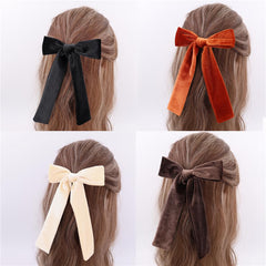 Sugarmelon long-tail velvet bow in fall pairs with autumn outfits.