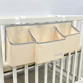 Surebaby hanging diaper caddy on crib rail keeps baby essentials within reach
