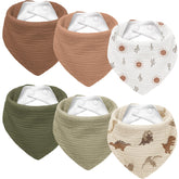 Susurration dinosaurs park bib with soft muslin front for gentle absorption.