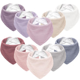 Susurration muslin baby bib with soft-front absorbent surface for gentle skin contact.