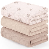 Susurration muslin receiving blanket with pink stars pattern calms newborns during swaddling