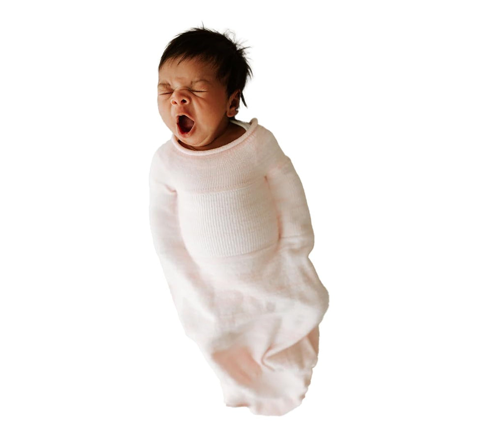 Swaddelini Swaddle Sleep Sack Pink closeup shows soft recycled nylon texture for gentle nights.