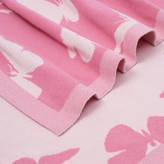 SWaddle AN two-sided butterfly design for reversible nursery styling.