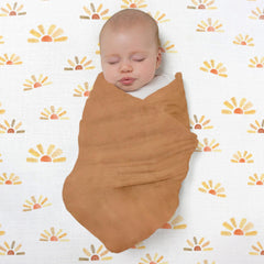 SwaddleDesigns Butterum blanket used as sunshield on stroller outings.